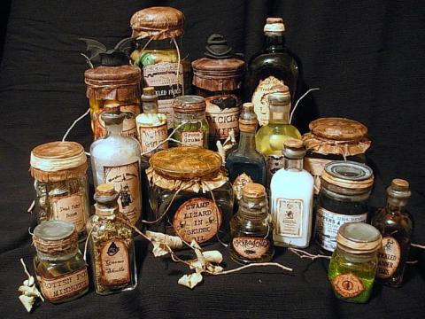 3 rows of glass jars of various sizes.  They are labeled with different potions. 